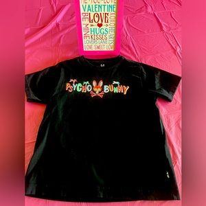 Psycho bunny boys black shirt . Printed name  logo at front .  Size M.